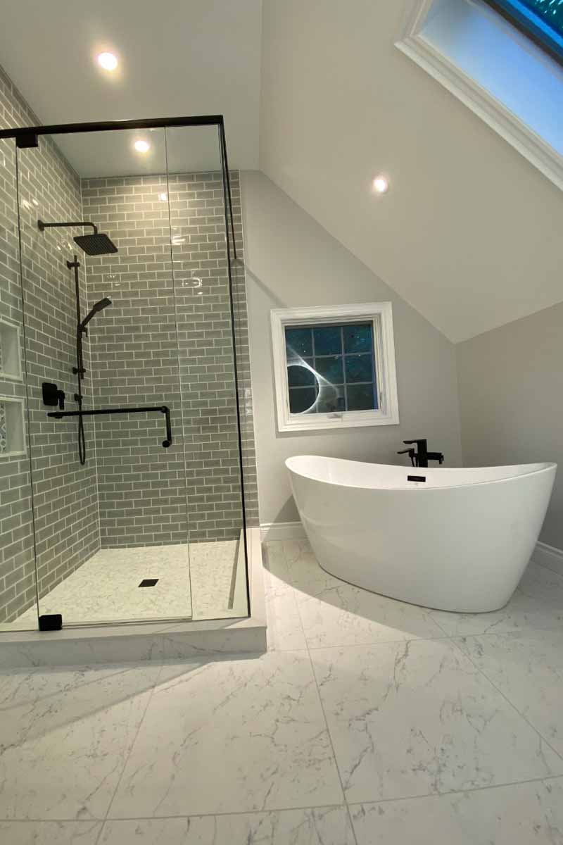 Beautiful bathroom glass walk in shower and freestanding bathtub