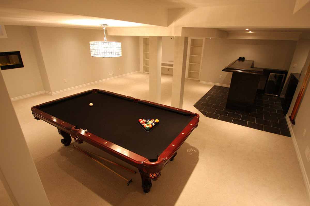 Beautiful custom renovated basement with pool table and custom bar area.